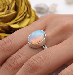 Ethiopian Opal Ring - 925 Sterling Silver Ring - Handmade Ring - Hippie Ring - Minimalist Gemstone Jewellery - Ring For Women   Gemstone Name - Ethiopian Opal Gemstone . Stone Quality - AAA. Ring Weight - 3.21 g  Length  - 1.4 cm Width -  1.1 cm Stone Shape - as Shown In The Picture. Ring Size - All Ring Size Available .  All Our Jewelry is Stamped 925  We serve complete 925 sterling silver Jewelry and genuine properties of the stone, Our all products are stamped 925. Product Quality and Packaging - Our all products are 925 Silver Stamped which shows that the product is genuine and authentic .The products are dispatched from the small business from UK so you get the product on time and the product packaging comes in bubble foil wrap with all the precautions taken primarily that your produc Minimalist Iridescent Round Jewelry, Iridescent Round Sterling Silver Jewelry, Iridescent Sterling Silver Round Jewelry, Everyday Opal Ring With Round Shape, Nickel-free Opal Rings As Gifts, Nickel-free Opal Ring As Gift, Nickel-free Opal Silver Ring, Iridescent Sterling Silver Crystal Promise Ring, Silver Opal Ring With Round Stone