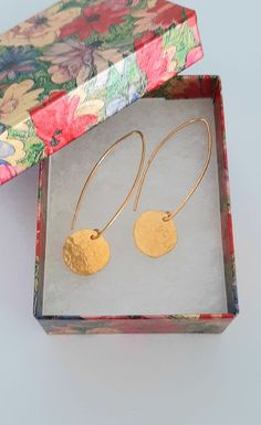 "All solid 24k gold through out. Stamped \"24K\". Ultimate minimalist elegance in a long pure gold, dangle earring. Disk is light catching and has lively reflection and movement. Total weight of pair about 4 grams of 24K gold. The disks are like little gold coins. Diameter is 1/2\" to 5/8\". Rustic hammered finish and slightly uneven edges on the disks for a unique look. Message me for a quote using heavier 18 gauge ear wires if desired." Gold Dangle Threader Earrings For Anniversary, Gold Threader Earrings For Gift, Gold Round Threader Earrings, Gold Single Threader Earring, Gold Drop Earrings For Anniversary, Yellow Gold Drop Threader Earrings Gift, Modern Hammered Linear Earrings For Gift, Modern Hammered Linear Earrings As Gift, Handmade Gold Long Drop Threader Earrings