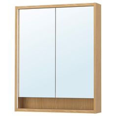 a bathroom medicine cabinet with two doors and mirror on the front, against a white background