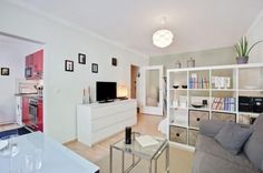 a living room filled with furniture and a flat screen tv