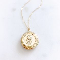 "DESCRIPTION: The CAMELLIA Necklace - Gold Round Floral Locket on a dainty gold filled chain. We love this sweet little necklace and think you will too! Insert a treasured photo and keep it close to your heart! The cutest way to show your love for someone special! MATERIALS: Chain, Clasp, Jump Rings - Gold Filled Locket - Gold Plated PENDANT SIZE: Approximately 3/4\" in diameter PACKAGING: Your necklace will arrive on a Dainty Doe signature jewelry card placed in a white jewelry box, with a bow Gift For Mom From Daughter, Herkimer Diamond Necklace, Silver Jewelry Cleaner, Necklace Locket, Star And Moon Necklace, Gold Locket Necklace, White Jewelry Box, Christmas Gift For Mom, Golden Necklace