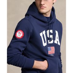 Part of the Polo Ralph Lauren Team USA Collection this cotton-blend hoodie features an official logo patch of the U.S. Olympic Team as well as an archival-inspired graphic that includes “Polo” and the American flag. Logo Cotton Hoodie For Fall, Sporty Logo Hoodie Top, Fall Cotton Logo Hoodie, Fall Cotton Hoodie With Logo, Cotton Logo Hoodie For Streetwear, Fleece Hoodie With Logo For Streetwear, Fleece Hoodie With Logo Detail For Streetwear, Cotton Hoodie With Logo And Crew Neck, Cotton Crew Neck Hoodie With Logo Detail