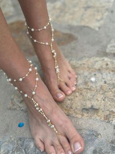 Wedding Barefoot Sandals Add a touch of elegance to your beach wedding with these beautiful handmade barefoot sandals. The anklet design features  beads, and rhinestones, making it perfect for the bride or bridesmaids. The pearls are delicately strung together, creating a charming and romantic look. These sandals are personalized with your choice of size and are suitable for your parties.  this anklet is a unique addition to any jewelry collection. You can take a look at my other products. If you have any questions about custom design or any other questions, please send me a message. Thank you for your visit. I wish you happiness Adjustable Pearl Anklets For Summer, White Pearl Anklets For Summer, Summer White Pearl Anklets, Elegant Beaded Anklets For Beach, Summer Pearl Anklets As Gift, Handmade White Anklets For Beach Wedding, Adjustable Beaded Pearl Anklets, Elegant Pearl Beaded Anklets, Elegant Beaded Anklets With Ankle Strap