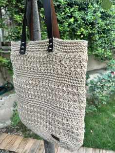 A handmade jute bag is a durable and eco-friendly bag that is made from natural jute fibers. These bags come in a variety of colors, sizes and styles, and are perfect for carrying items to the beach, shopping, or anywhere else. They feature sturdy handles made from jute or cotton, and often have a cotton lining with an interior pocket. They are often decorated with hand-painted designs, or embroidery, to give them a unique and stylish look. Beach Shopping, Painted Designs, Jute Bag, Eco Friendly Bags, Boho Bags, Jute Bags, Natural Jute, Summer Crochet, Crochet Bag