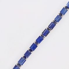 Indulge in the timeless allure of our 18K White Gold Octagon Blue Sapphire Tennis Bracelet—an exquisite blend of sophistication and elegance. Crafted with meticulous precision, this bracelet features a stunning array of octagon-cut blue sapphires, each gemstone meticulously set in lustrous white gold Timeless Blue Bracelet For Formal Occasions, Luxury Blue Diamond Bracelet, Timeless Blue Diamond Bracelet, Blue Rectangular Faceted Jewelry, Luxury Blue Gemstone Diamond Bracelet, Formal Octagon-shaped Fine Jewelry Bracelet, Formal Octagon-shaped Fine Jewelry Bracelets, Formal Octagon Shaped Fine Jewelry Bracelets, Elegant Sapphire Faceted Bracelets