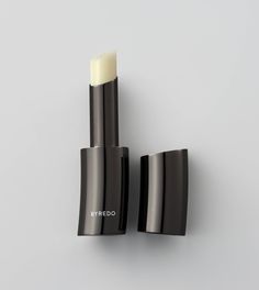 A 99.8% natural, ultra-nourishing formula, smooth, gliding and genderless, one single coat is enough for hours of comfort. In its distinct curvilinear, anthracite metal casing – echoing bamboo – weight and precision are utilised. The slim-line stick contained within is sealed with a magnetic click. Lipgloss Lips, Vegan Lip Balm, Natural Lip Balm, Tinted Lip Balm, Makeup Designs, Natural Lips, Lip Tint, Makeup Collection, Lip Care