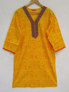 "ITEM DESCRIPTION yellow geometrical screen printed bohemian women kurtis and tunics | 3/4th sleeve summer kurtis | v neckline yoke with lace border kurtis Features : 3/4th sleeve, v neck, Kurtis Material : Cotton Cambric Fabric: 100% cotton soft light weight ethnic print fabrics Sleeve Length = 18 inch For more sizes & their measurement, please refer our below chart to understand the sizes variations available with us For your size requirement, please mention your size in seller note at the Traditional Yellow V-neck Kurta, Yellow V-neck Traditional Kurta, Bohemian Long Sleeve Kurta With Printed Border, Summer V-neck Block Print Kurta, Traditional V-neck Printed Kurta, Bohemian Yellow Printed Kurta, Summer Yellow Block Print Kurta, Summer Yellow Kurta With Block Print, Summer Yellow Bandhani Print Kurta