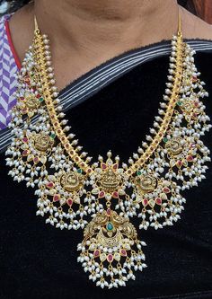 22 Karat Gold "Lakshmi - Peacock" Guttapusalu Necklace & Drop Earrings Set With Cz, Pearls,Beads, Color Stones & Japanese Culture Pearls (Temple Jewellery) - 235-GS3610 - in 121.350 Grams for USD $10,275.82 USD. 
Made in India by Totaram Jewelers Online this product is in Gold - 22 Karat BIS Hallmark 916 Gold  & is an excellent gift for Adult - Women. Ships fully insured with secured guaranteed delivery for free with your order over $250 from New Jersey USA & comes with 30 days exchang Peacock Guttapusalu, Guttapusalu Necklace, 22k Gold Necklace, Peacock Necklace, Chandbali Earrings, Antique Jewelry Indian, South Indian Jewelry, Color Stones, Gold Necklace Set