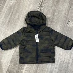 Baby Gap Coldcontrol Lightweight Puffer Jacket Green Camo Quilted Water-Resistant Outer. Full Front Zip Closure W/ Hood Front Slant Pockets Long Sleeves With Banded Cuffs Nwt- Shipping From A Smoke And Pet Free Home Gap Outdoor Outerwear With Pockets, Casual Green Outerwear For Playtime, Green Outerwear For Playtime In Fall, Green Fall Outerwear For Playtime, Green Spring Outerwear For Playtime, Gap Long Sleeve Outerwear For Playtime, Camo Quilt, Lightweight Puffer Jacket, Gap Jacket