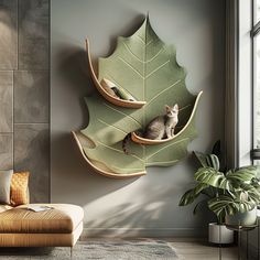 a cat sitting in a green leaf shaped shelf