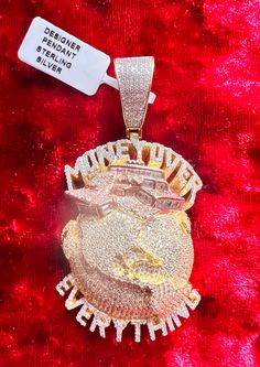 "14kt gold plating over 925 sterling silver, AAA CZ, iced out, all bling, money over everything pendant. Comes with 20\" steel rope chain. Length of the pendant is 1.5\" and Height is 2.5\" including bail. Every effort is made to show the item as it appears to the eye but items may be bigger or smaller depending on the way they were photographed.Please read the measurements under each listing and message me for any questions.Thanks" Iced Out Cubic Zirconia Jewelry For Streetwear, Streetwear Iced Out Jewelry With Cubic Zirconia, Streetwear Iced Out Cubic Zirconia Jewelry, Luxury Diamond Jewelry For Streetwear, Luxury Bling Jewelry For Streetwear, Iced Out Sterling Silver Jewelry For Streetwear, Iced Out Pendant Jewelry For Streetwear, Iced Out Pendant For Streetwear, Money Over Everything