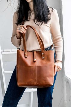 ● Comfortable and popular leather tote bag. It is made of full grain leather cognac color. Great for daily use. Ideal for work, study. The bag has pockets, so it is very roomy and functional (for a phone, book, keys, tablet, Mac, cosmetic bag, etc.). This bag can be a wonderful gift for a birthday, Christmas and New year gift. Handmade leather bag! ● ● Unique leather over time gets better. A bag can be made in different leather colors: cognac, chocolate, black, caramel, olive, yellow, burgundy, Everyday Brown Weekender Bag With Smooth Grain, Brown Weekender Bag With Leather Handles, Cognac Satchel Weekender Bag For Everyday, Cognac Weekender Bag With Smooth Grain, Cognac Smooth Grain Weekender Bag, Cognac Leather-lined Tote Weekender Bag, Cognac Tote Weekender Bag, Cognac Soft Leather Weekender Bag, Everyday Smooth Grain Tote Weekender Bag