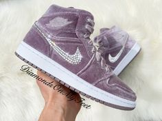 Bling Air Jordan 1 Mid Shoes Hand Customized with Genuine Swarovski Crystals Colors: Purple Velvet w/ White Soles Model and Color Code: #DQ8397-500 Note: Box may be missing top lid or shoe box Each and every Swarovski crystal is set by hand with top quality, permanent adhesive. Our products come direct from the manufacturer or authorized retailers, and are 100% authentic. We offer free crystal replacement for life! Should any crystals fall off, simply send your shoes back to us and we'll fix them for only the cost of shipping! Here are some other options you might like: https://etsy.me/2O6KIZp https://etsy.me/33Hy21z https://etsy.me/34XSbAN https://etsy.me/2pjfnug Rosa Jordans, Pinterest Room, Pink Jordans, Ball Shoes, Pretty Sneakers, Mid Shoes, Velvet Sneakers, Custom Bling, Nike Air Jordan 1 Mid