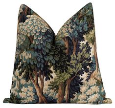 a blue and green pillow with trees on it