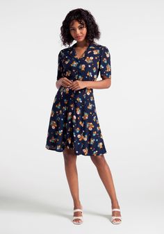 Floral bursts in beautiful autumnal shades give this 70’s-inspired shirtdress from Aussie brand Princess Highway just the right amount of retro vibe. Made from a navy blue viscose weave, this A-line dress boasts a smart lapel collar, full front button closure, short sleeves, a semi-fitted bodice, and a darling flared skirt that finishes at the knee. 100% Viscose. Fabric does not provide stretch. Front button closure. Fits true-to-size- See AUS size chart. Hand wash cold, lay flat to dry. Importe Spring Knee-length Rayon Shirt Dress, Knee-length Rayon Shirt Dress For Spring, Fitted Viscose Shirt Dress For Fall, Collared Viscose Dresses For Fall, Fitted Short Sleeve Rayon Shirt Dress, Fitted Collared Viscose Dresses, Fall Viscose Collared Dress, Collared Viscose Shirt Dress For Fall, Fall Viscose Collared Shirt Dress