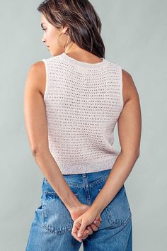 Unleash your inner style with our chic Checkmate top. This sleeveless crochet knit top features a delicate pink and lavender checkered pattern, adding a touch of elegance to any outfit. Perfect for the fashion-forward individual looking for a luxurious and exclusive addition to their wardrobe. 40% Polyester, 40% Acrylic, 20% Rayon See size chart for size details Some stretch Casual Pointelle Knit Vest For Spring, Chic Sleeveless Pointelle Knit Vest, Chic Spring Textured Knit Tank Top, Chic Textured Knit Tank Top For Spring, Trendy Spring Knit Vest Top, Chic Pointelle Knit Sleeveless Sweater Vest, Chic Pointelle Knit Sweater Vest, Sleeveless Textured Knit Tops For Spring, Trendy Open Knit Sweater Vest For Spring