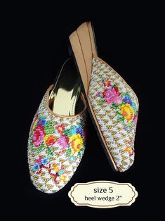 Peranakan beaded slippers, also known as kasut manek, meaning beaded shoes, is worn by a Nyonya to complete her Sarong Kebaya outfit. The colours and motifs for Nyonya beadwork often reflect a combination of Chinese, Malay, Indian and European influences.  In the past, young female Nyonyas were required to make a pair for themselves and their husbands to be. Kasut manek suitable to wear with sarong-kebaya for a traditional look, and suitable for a casual look too. Panel is cushioned for comforta Traditional Handmade Slippers With Round Toe, Traditional Embroidered Round Toe Slippers, Traditional Flat Heel Summer Slippers, Traditional Flat Slippers For Summer, Traditional Embroidered Slip-on Slippers, Traditional Flat Summer Slippers, Traditional Multicolor Slip-on Slippers, Traditional Multicolor Closed Toe Slippers, Traditional Summer Slippers With Round Toe