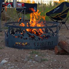 a fire pit sitting in the middle of a field