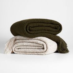 three towels stacked on top of each other with one folded up and the other folded down