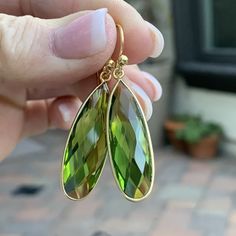 These beautiful peridot earrings are faceted and teardrop shaped in a gold plated bezel setting. The ear wires are also gold plated. Total length: 1.75 inches Peridot teardrop with bezel alone: 34 x 11 x 6mm To see more from East Village Jewelry~ http://eastvillagejewelry.etsy.com All orders ship out within 24 hours, excluding holidays and Sundays Feel free to contact me with any questions. Use coupon code VILLAGE14 for 10% off all orders over $200.00 THIS ITEM WILL SHIP OUT WITHIN 24 HOURS OF O Bezel Earrings, Peridot Earrings, Rectangle Earrings, Garnet Earrings, East Village, Code Promo, Lovely Earrings, Turquoise Earrings, Bezel Setting