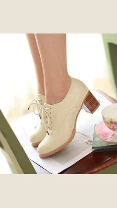 Discover elegance with our Chic Beige High Heels Fashion Oxford Shoes. Perfectly blending classic style and modern flair, these high heels feature a sophisticated beige finish and timeless oxford design. Elevate any outfit with these must-have shoes. Shop now for a touch of class! Elegant Low Heel Lace-up Shoes For Work, Elegant Spring Oxfords With Brogue Detailing, Retro Formal Oxfords, Cream Heels With Wooden Heel And Round Toe, Chic Formal Closed Toe Lace-up Shoes, Classic Round Toe Heels For Spring, Beige Round Toe Heels For Work, Cream Round Toe Oxfords For Formal Occasions, Classic Spring Heels With Round Toe