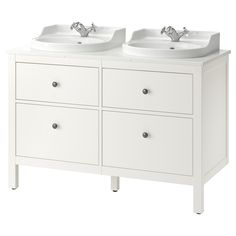 two white sinks sitting next to each other on top of a cabinet with three drawers