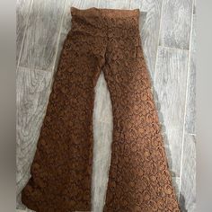 From Hemline Nwt Crochet Pants With Shorts Lining. There Is No Label Of Size But They Fit Like A Small. Elastic Waist With Some Stretch. Great Looking Pants For Fall. Sexy!!! Spring Stretch Brown Pants, Brown Stretch Pants For Spring, Fall Stretch Lace Bottoms, Non-stretch Lace Pants For Spring, Stretch Lace Bottoms For Fall, Fall Lace Stretch Bottoms, Lace Stretch Bottoms For Fall, Casual Lace Wide Leg Bottoms, Full-length Lace Bottoms With Stretch