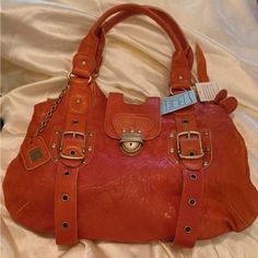 Cynthia Rowley Rare Htf Triple Compartment Leather Framed Kisslock Satchel In Color Spice Nwt!! $395! Pics Are Exactly The Condition Of The Bag! Never Used So It Is Still Nwt! This Is A Satchel Style Bag As In The Description And Can Fit Comfortably Over The Shoulder For A Smaller Framed Person. I Hoped It Would Fit My Shoulder Comfortably But I’m A Larger Framed Gal And It Was Just Not For Me, Sadly. Perfect Fall Bag! Very Pretty Color And The Softest Leather With Some Sturdy Hardware! Love Thi Designer Orange Leather Shoulder Bag, Designer Orange Leather Bags, Orange Leather Bags With Branded Hardware, Vintage Orange Leather Bags, Orange Leather Shoulder Bag With Gold-tone Hardware, Designer Orange Satchel Shoulder Bag, Chic Orange Leather Shoulder Bag, Orange Shoulder Bag With Branded Hardware For Travel, Travel Shoulder Bag With Branded Hardware In Orange