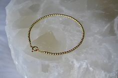 "Delicate gold hematite gemstone beaded bracelet is a perfect bridesmaid gift or Christmas present. This tiny boho minimalist gold plated hematite jewelry can be perfect for everyday wear as well. . ❗️Sign up to our Newsletter and get 15% OFF your order (copy this link to browser search) - https://forms.gle/R74xLdL1MSmC9Apn6 ❗️ . MEASUREMENTS: Beads: 2 mm; Gemstone: Gold plated hematite Metal: gold vermeil (gold plated 925 sterling silver) Quantity: 1 bracelet. . HEMATITE PROPERTIES: Hematite wo Blue Lace Agate Bracelet, Black Spinel Bracelet, Bracelets Red, Blue Gemstone Bracelet, Pyrite Bracelet, Hematite Jewelry, Stack Bracelets, Minimal Bracelet, Hematite Bracelet