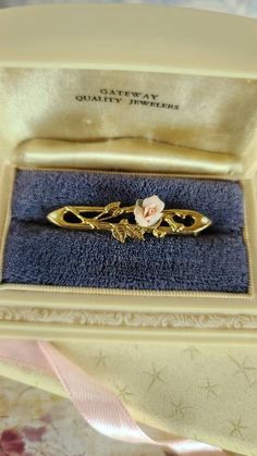 This is a beautiful vintage porcelain rose bar brooch set in a gold tone metal. Hallmarks: NONE Condition: Fair condition. One petal has broken off. Please see photos. Sold as is. Priced accordingly. Please look over carefully and inspect any and all photos. Our shop is committed to fully disclosing all items' conditions and history with as great of detail as possible. Please keep in mind; what constitutes as new or unused condition for older era jewelry differs from non-vintage pieces; please c Rose Bar, Sand Dollar Pendant, Bar Brooch, Rose Brooch, Porcelain Roses, Milwaukee Wi, Vintage Pieces, Vintage Porcelain, Gold Tone Metal