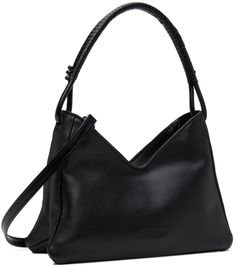 Grained leather shoulder bag in black. · Knotted detailing at hand-wrapped fixed carry handle · Adjustable and detachable crossbody strap · Logo embossed at face · Zip closure · Patch pocket at interior · Moiré lining · Logo-engraved silver-tone hardware · H7 x W10 x D3 Supplier color: Black Silver Engraving, Hand Wrap, Cream And Gold, Crossbody Strap, Bag Sale, Leather Shoulder Bag, Patch Pocket, The Face, Silver Tone