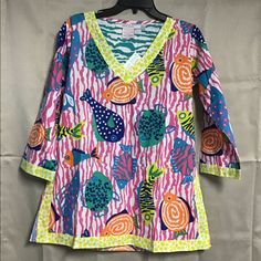 Gretchen Scott Tunic Fishy School Is The Name Of The Top Generous Fit Top Lightweight Tunic Playful Long Sleeve Tops For Vacation, Fun Pink Tops For Beach Season, Fun Pink Top For Beach Season, Fun Pink Tops For Vacation, Fun Pink Floral Print Tops, Playful Pink Tops For Vacation, Playful Pink Tops For Beach Season, Fun V-neck Tops For Vacation, Kimono Style Jacket