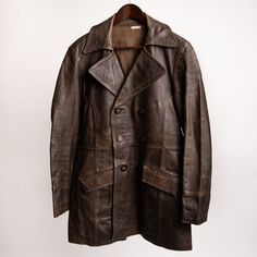 "Vintage 50s French Brown Leather Buttoned Jacket - Size Medium Lasted out the years in excellent condition with some beautiful patina. Unique odd-shaped buttons, not sure of the material used. Condition: 9/10 Light Scuff marks, found mainly on the back but nothing major. Size: Medium please check the measurements provided below to ensure a great fit Measurements: Pit 2 Pit - 19\"  Neckline Down - 32\" Shoulder 2 Shoulder - 17\" Sleeve Length - 23\" Please note, I will state all significant wear Retro Double-breasted Outerwear With Button Closure, Vintage Leather Jacket With Pockets, Vintage Long Sleeve Pea Coat With Button Closure, Vintage Double-breasted Outerwear With Button Closure, Vintage Distressed Brown Leather Jacket, Vintage Fitted Brown Outerwear, Fitted Retro Vintage Brown Outerwear, Vintage Distressed Brown Outerwear With Pockets, Fitted Brown Vintage Outerwear