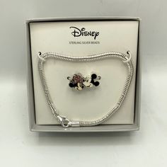 the disney sterling silver bead bracelet with mickey mouse charms is displayed in its box