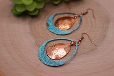 Item Overview *Handmade item *Raw Copper Patina with copper accent *Ships anywhere in the US from Bellingham, Washington Item Details Unique Copper patina teardrop shaped dangle earrings with raw copper accent Made of raw copper that has hand hammered, domed and Patinaed by me Patina is a passion of mine because we love the results.  This process of this verdigris patina takes two days. This pair is a beautiful blue/green with dark accents. Patina is a unique finish and no two pair will be exactly alike but will strongly resemble the picture. Product Overview - Hand hammered, dome shaped and patina - Very light weight and versatile -The copper patina pieces are covered by a thin layer of lacquer in order to save natural color of patina.  - NOTE:  Earrings are shipped with raw copper ear wi Handmade Teardrop Copper Earrings, Handmade Copper Teardrop Earrings, Artisan Teardrop Copper Earrings, Artisan Copper Teardrop Earrings, Copper Teardrop Earrings With Patina, Copper Teardrop Jewelry With Matching Earrings, Teardrop Copper Jewelry With Matching Earrings, Teardrop Copper Jewelry Set With Matching Earrings, Teardrop Metal Jewelry With Patina