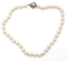 Vintage Fashion Jewelry - This is a strand of hand knotted creamy white glass pearls with a sterling silver clasp. The necklace is 15" long, pearls are 8mm wide, slide in locking clasp has ruby red and clear crystals with side safety clip. Classic Beaded Necklaces With Pearl Drop, Classic Pearl Drop Beaded Necklace With Round Beads, Formal Pearl Necklace With 8mm Beads, Formal Round Beaded Necklace With Pearl Charm, Formal Single Strand Pearl Beaded Necklace, Formal Pearl Beaded Necklaces With Round Beads, Adjustable Beaded Pearl Necklace For Formal Occasions, Classic White Beaded Pearl Necklace, Classic Pearl Beaded Necklace For Formal Occasions