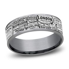 a men's wedding band with the word london on it in black and white