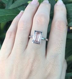 "A stunning north south setting featuring a rectangle shaped genuine flawless Morganite from Brazil is bezel set with a polish finish makes a lovely engagement/promise/statement ring. Wrapped in a box ready for gift-giving. Morganite measure 9.5mm x 6mm ---> Don't know your ring size? Purchase our ring sizing gauge https://www.etsy.com/listing/290720637/ring-sizer-ring-sizing-gauge-multisizer?ga_search_query=ring+sizer&ref=shop_items_search_1 *Follow us @belesasjewelry on Instagram for pr Minimalist Promise Ring, Pink Stone Engagement Rings, Engagement Ring Modern, Modern Engagement Rings, Moonstone Engagement Ring, Morganite Ring, North South, Stone Engagement Rings, Ring Sizer