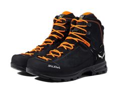 a pair of black and orange hiking boots