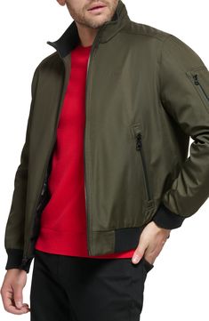 Every closet craves this edgy bomber styled with handy side pockets, a water-resistant finish and comfy ribbed trim. Front zip closure Stand collar Front zip pockets Ribbed cuffs and hem Water resistant Lined 100% polyester Machine wash, line dry Imported Fall Nylon Outerwear With Zip Cuffs, Modern Outerwear With Ribbed Cuffs For Spring, Modern Spring Outerwear With Ribbed Cuffs, Casual Track Jacket With Zip Cuffs For Work, Green Outerwear With Zip Cuffs For Fall, Sporty Spring Outerwear With Zip Cuffs, Casual Outerwear With Zip Cuffs For Outdoor, Modern Nylon Outerwear With Ribbed Cuffs, Trendy Nylon Outerwear With Ribbed Cuffs