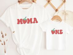 Introducing our super cute strawberry theme birthday t-shirts, for a boy or girls' berry sweet theme party. These shirts are high quality and made with 100% soft ringspun cotton for very comfortable wear.   HOW TO ORDER 1. Select the color and size/name from the drop-down menu and add it to the cart 2. Repeat the process if you want to order more shirts 3. If you want a custom shirt, please select that from the menu and add the name to the personalization box NB: We have multiple options for Mom Sweet White T-shirt For First Birthday, Sweet T-shirt For Summer Birthday, Sweet Summer Birthday T-shirt, Red T-shirt For Birthday In Summer, Sweet Cotton T-shirt For First Birthday, Cute Strawberry Print Top For Birthday, Red Cotton T-shirt For First Birthday, Red Crew Neck Top For First Birthday, Family Matching Red Tops For Birthday