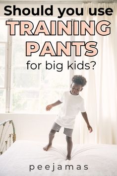 a young child standing on top of a bed with the words should you use training pants for big kids?