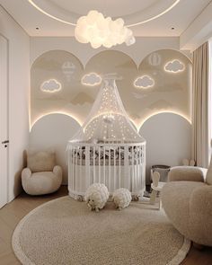 a baby's room is decorated in white and features clouds on the ceiling, crib, rocking chair, and round rug