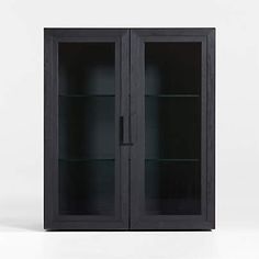 an empty black glass cabinet with two doors and shelves on the front, against a white background