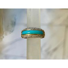 14 karat yellow gold ring, inlaid with a strip of Persian turquoise surrounded by .25 carats of shimmering pavé diamonds. Size 6.5. Marked with maker's mark and stamped 14 KT/585. Fine Gold Turquoise Ring With Diamond Accents, Gold Diamond Turquoise Ring For Anniversary, Turquoise Ring With Diamond Accents For Anniversary, Persian Turquoise, Maker's Mark, Yellow Gold Ring, Yellow Gold Rings, Pave Diamonds, Makers Mark