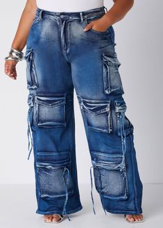 We're going full throttle in easily one of the most coveted & popular styles of jeans: the cargo jean! Pockets abound, we've added a whiskered technique to create this multi-toned hue effect that boosts the edgy factor on the look. Trendy Distressed Blue Cargo Jeans, Trendy Blue Distressed Cargo Jeans, Blue Distressed Utility Bottoms, Distressed Blue Utility Bottoms, Utility Distressed Blue Bottoms, Utility Style Distressed Blue Bottoms, Distressed Denim Blue Cargo Jeans For Fall, Distressed Medium Wash Cargo Jeans For Fall, Trendy Distressed Denim Blue Cargo Jeans