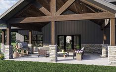 a covered patio with chairs and tables under a wooden roof over looking the grass area