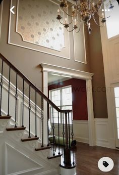 a chandelier hanging from the ceiling in a house