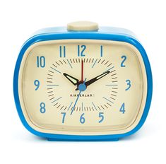 a blue and white alarm clock on a white background