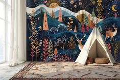 a teepee tent in front of a colorful wall mural